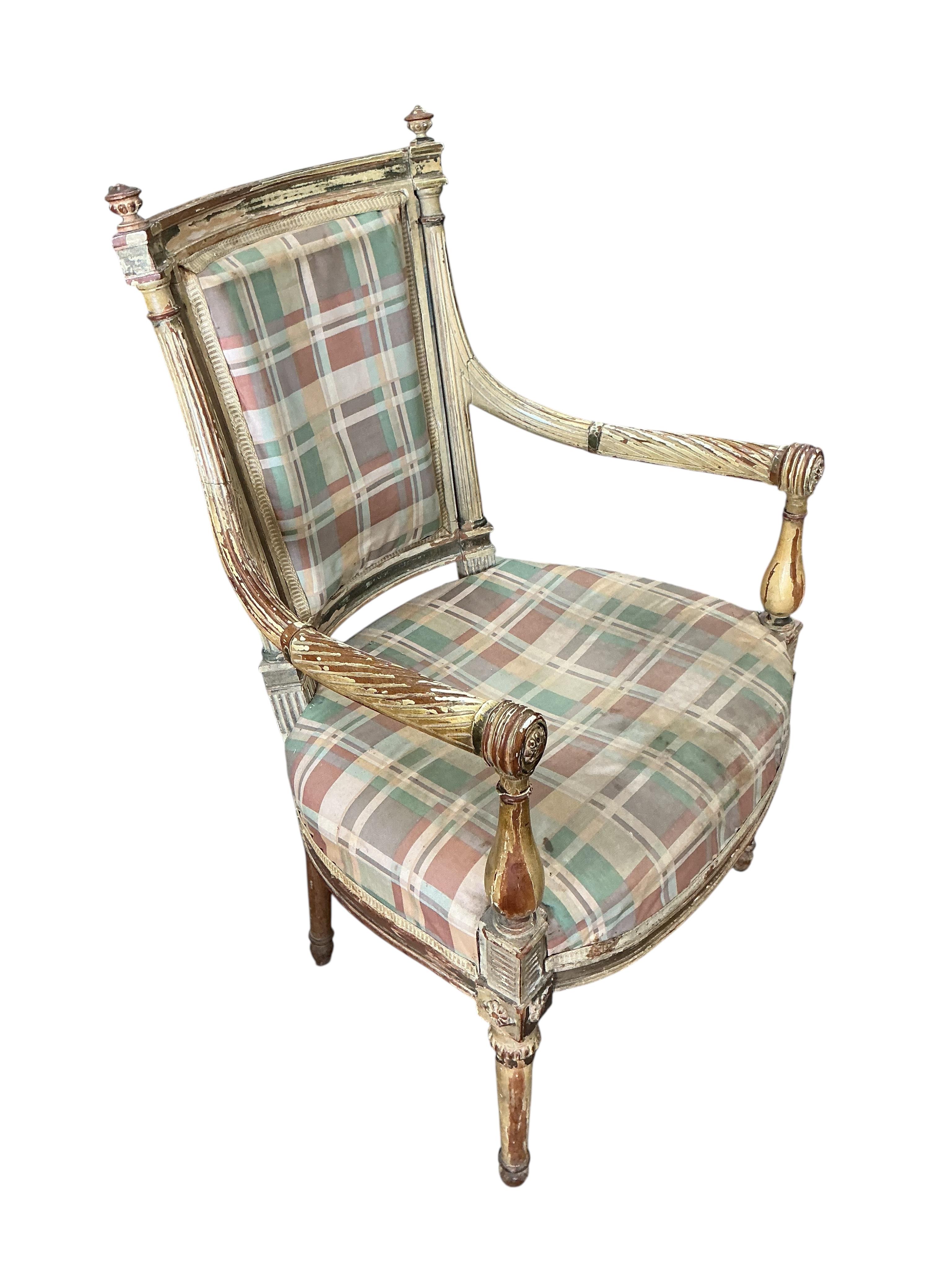 A Louis XVI style cream painted and parcel gilt open armchair, width 55cm, depth 60cm, height 90cm